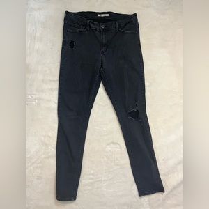 Black distressed Levi skinny jeans